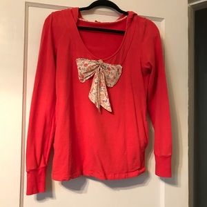 Hoodie top from Anthropologie. Orange with bow